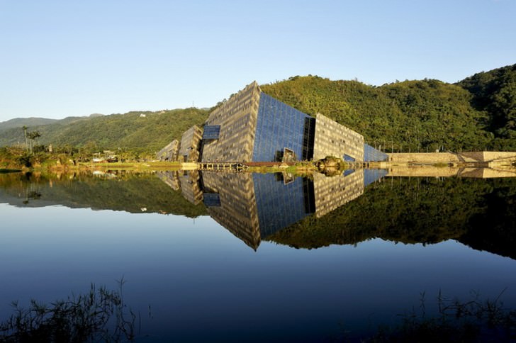 A range of granite and cast aluminum panels are used on the building